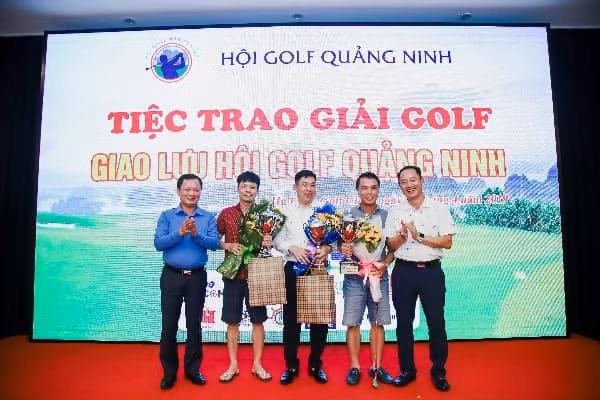 Giving awards to golfers at 2019 friendly match