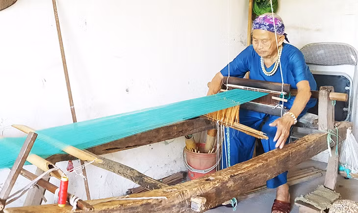 Ms. Ly Thi Chuong, 80, is the only one in Binh Lieu to retain all skills in weaving and making traditional costumes.