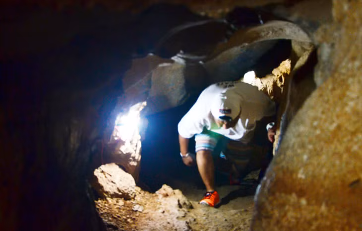 Tourists have to bend their knees to get through at some turning points in the cave.