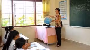 Nguyen Thi Hoi teaches a geography lesson to students at the remote island Ban Son Primary School. 