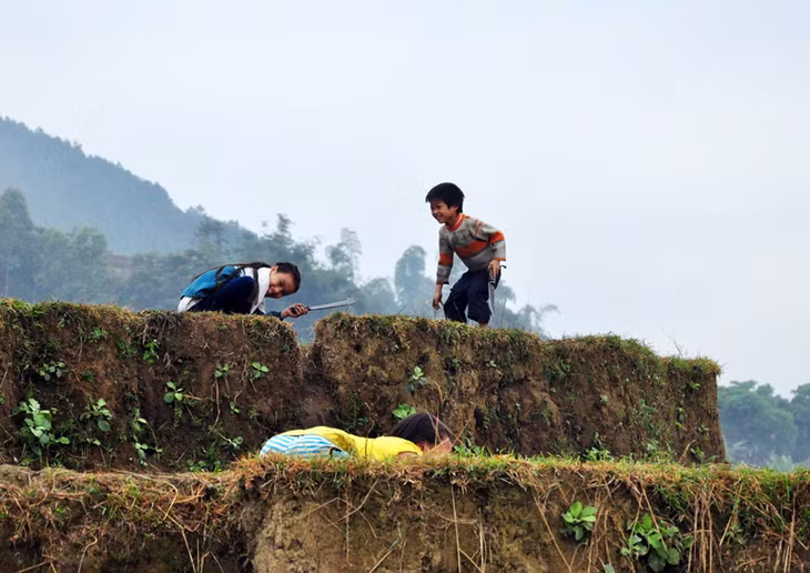 Happy children are playing on terraced fields