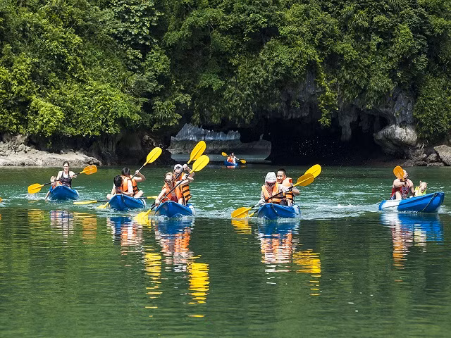 Visiting Vong Vieng fishing village by bamboo boats rowed by local people, discovering the rocky mountains and lagoon of the wild and magnificent Ha Long Bay, a world heritage site, and enjoying the fresh air of the sea.