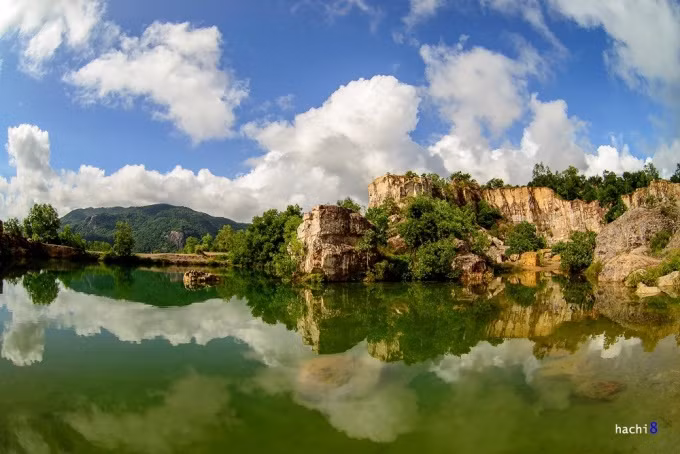 A crystal clear lake by mountains in southern Vietnam. Photo by VnExpress