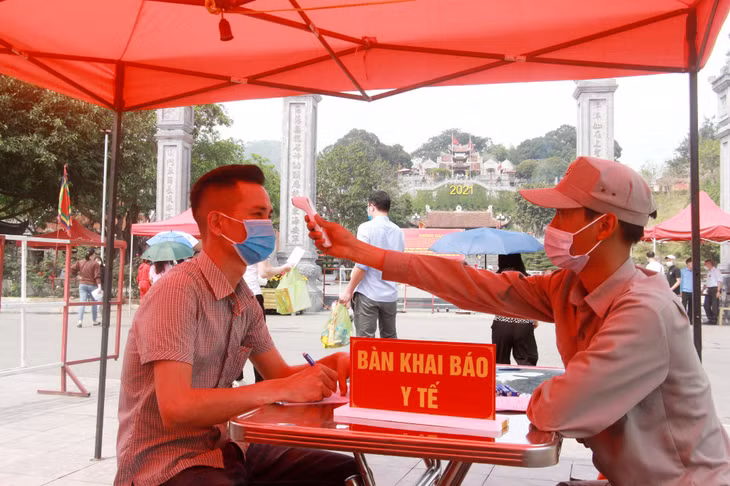 They also have their body temperature measured before entering the temple.