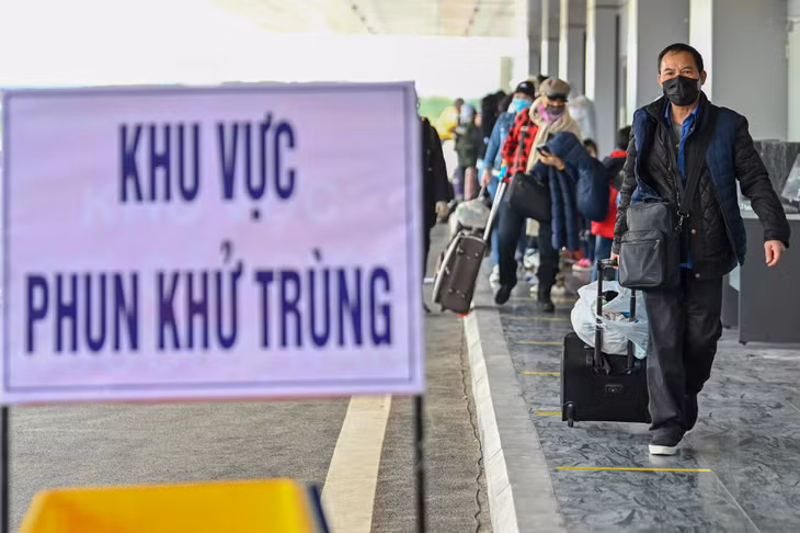 Passengers undertake entry procedures...