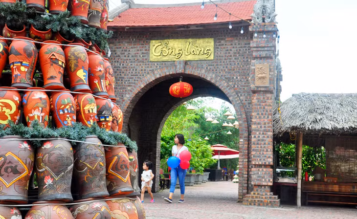 Tourists take a walk at Quang Ninh Gate