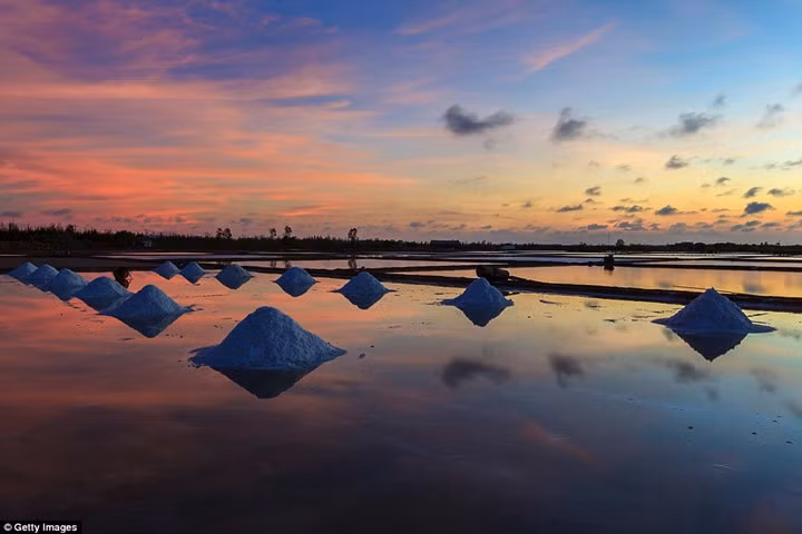 Vietnam has many attractions, its salt fields being one. During the day, it's busy with harvesters who together amass an annual salt production of around 700,000 tons, but as the sun goes down, it's a shrine to tranquillity