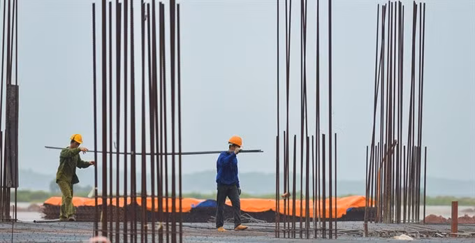 Officials are accelerating construction on Van Don International Airport. - Photo zing.vn