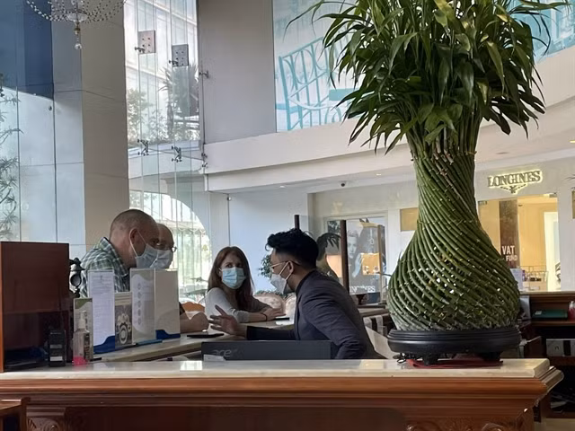 Foreign tourists at a hotel in downtown HCM City.