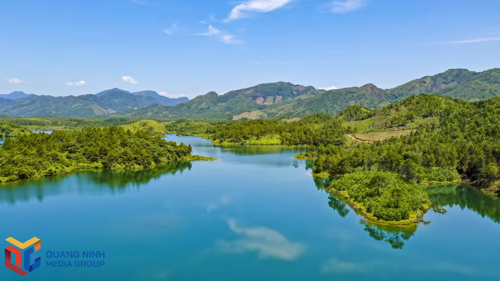 The lake water is clear and calm like a giant mirror imprinted with mountains and clouds.
