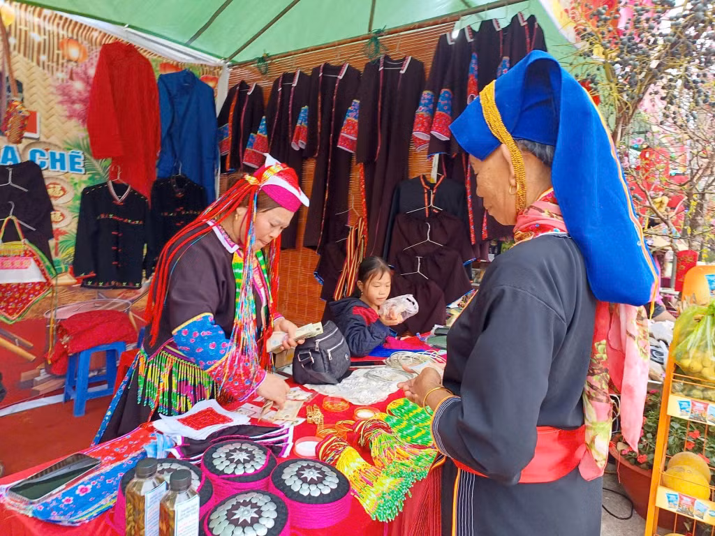 Members of the Dao Thanh Y community present their intricate hand-embroidered traditional attire.