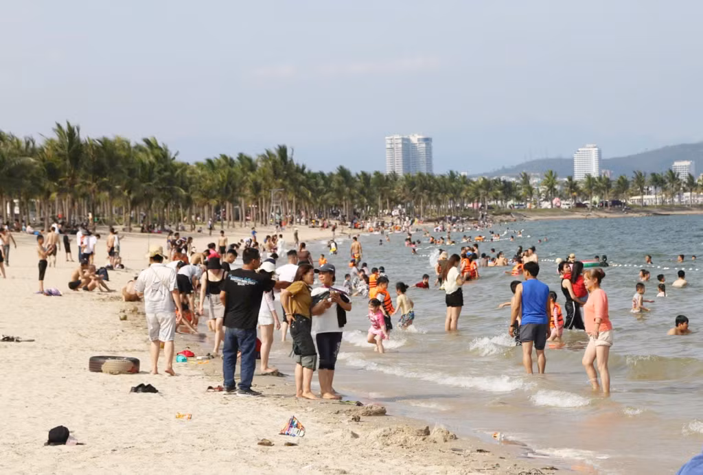 Visitors come to Tuan Chau and immerse themselves in its refreshing waters.