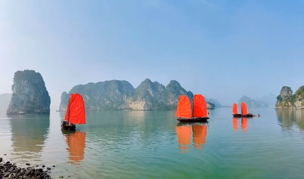 The distinctive reddish-brown sails of traditional three-panel boats have returned to Ha Long Bay.
