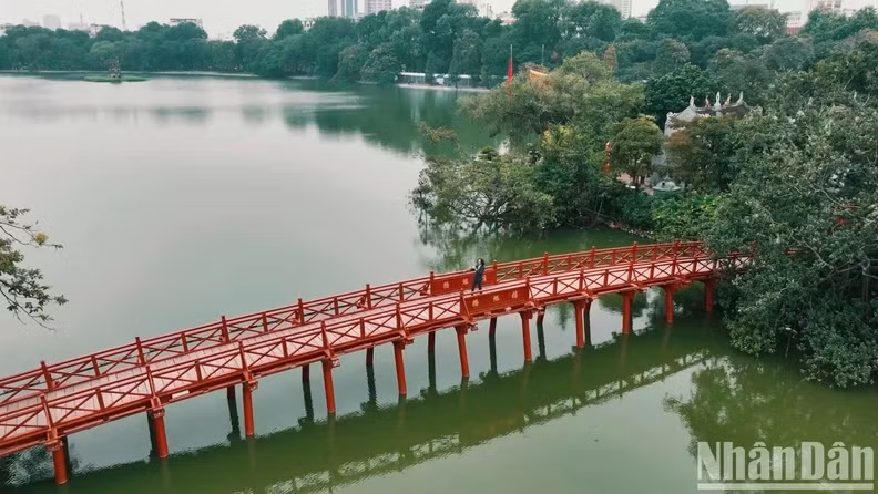 The Huc Bridge is a highlight among the quiet green patches.