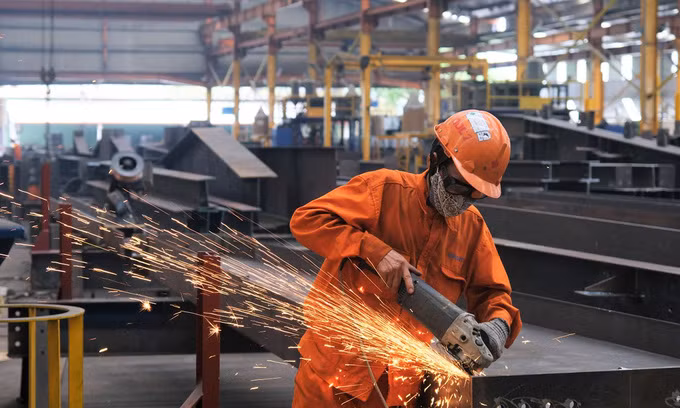 A worker is seen at engineering and construction company in Ho Chi Minh City. 