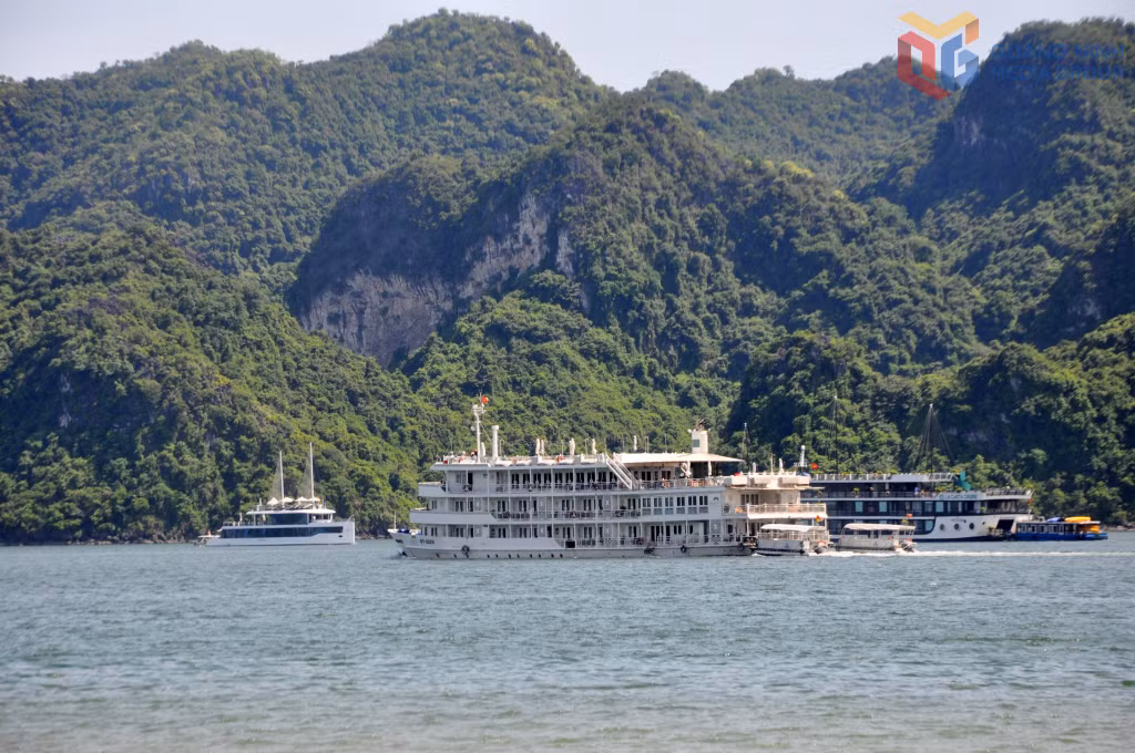 A cruise ship carries guests for overnight stays on Ha Long Bay