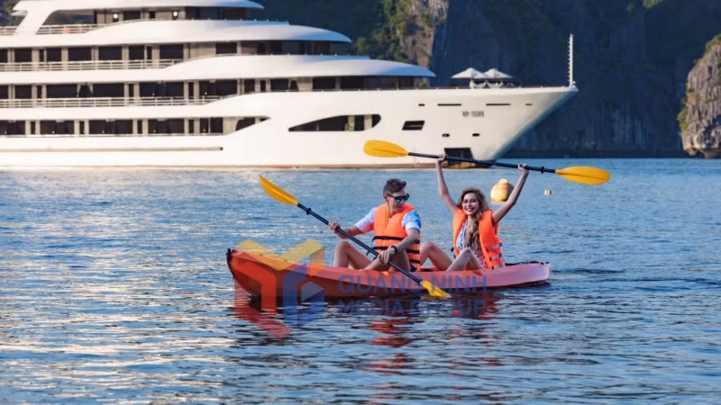 Tourists enjoy kayaking in Ha Long Bay.