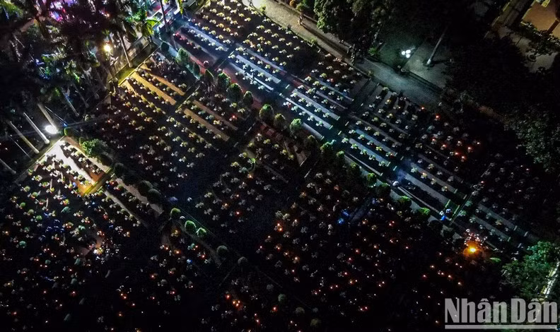 A bird's-eye view of the candlelit vigil at the Hanoi Martyrs Cemetery.
