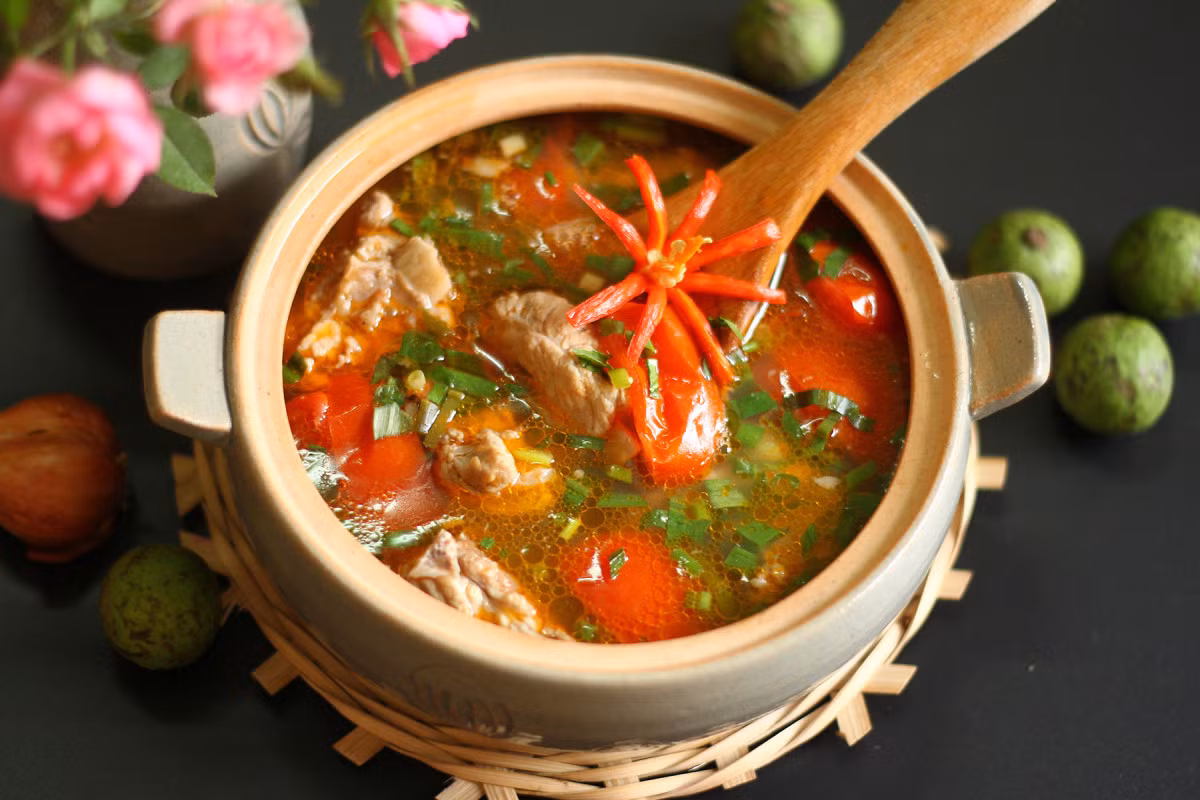 Diners can savor the zesty goodness of canh chua suon with flavors of dracontomelon and herbs. Photo by