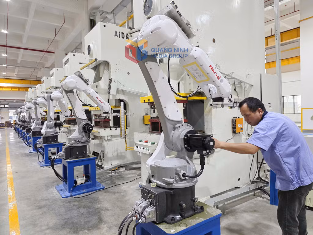 The manufacturing facilities at EVA Quang Ninh Precision Industry Co., Ltd. are equipped with industrial robots, robotic arms, and advanced production equipment.