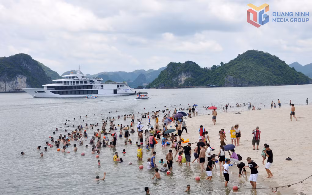 Tourists swim and enjoy summer activities at the beach on Ti Top Island.