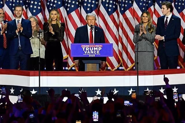 Donald Trump is accompanied by family members as he addresses supporters at his rally, at the Palm Beach County Convention Center in West Palm Beach, Florida, November 6. — Getty Images/VNA