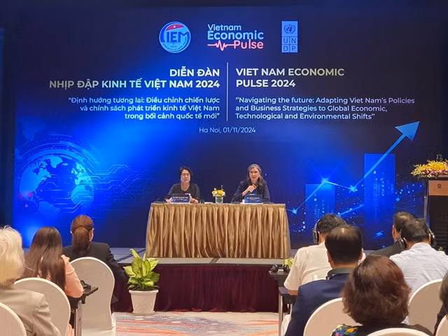 Ramla Khalidi, United Nations Development Programme (UNDP) and Trần Thị Hồng Minh, President of the Central Institute for Economic Management. — VNS Photo Nhật Hồng