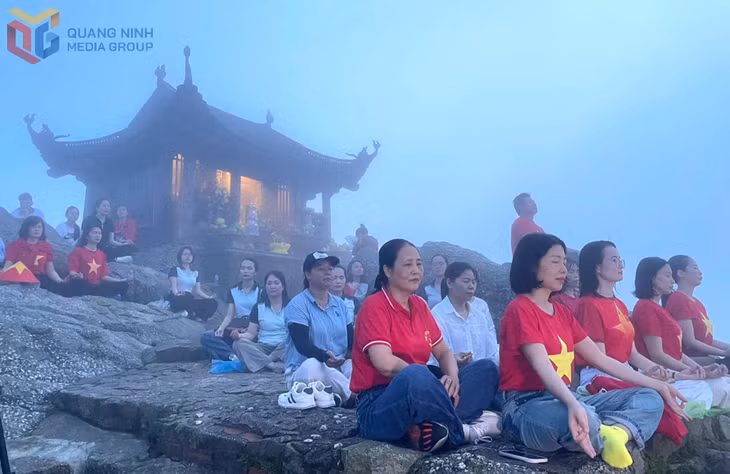 Visitors take part in a meditation experience at the summit of Dong Pagoda.