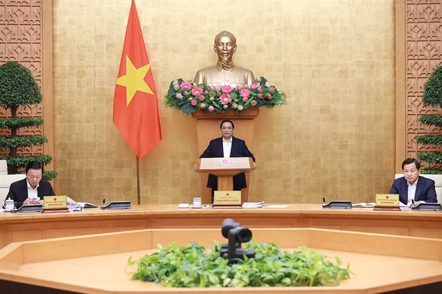 Prime Minister Phạm Minh Chính (centre) chairs the Government’s March session on law-making in Hà Nội on March 27. — VNA/VNS Photo Dương Giang