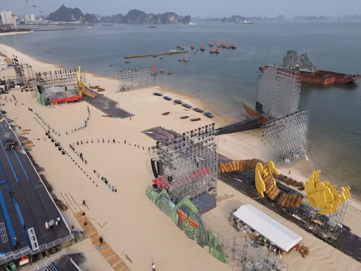 People prepare for their performances at the area of the main stage close to the bank of Ha Long Bay