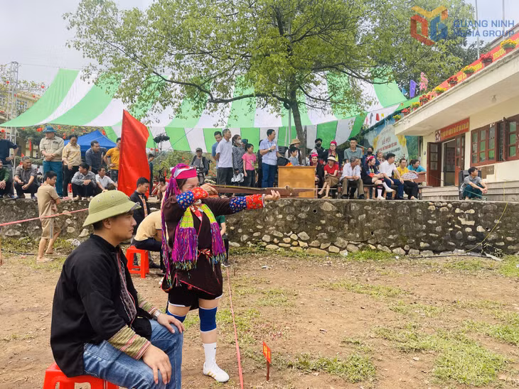 Women are confidently competing in a crossbow shooting contest.