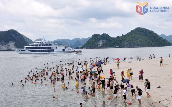 Tourists swim and enjoy summer activities at the beach on Ti Top Island.