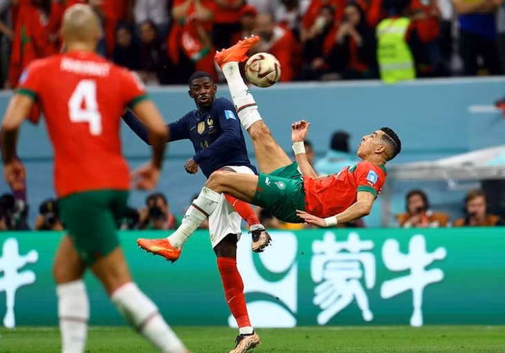 Morocco's Jawad El Yamiq shoots at goal with an overhead kick. (Photo: REUTERS)