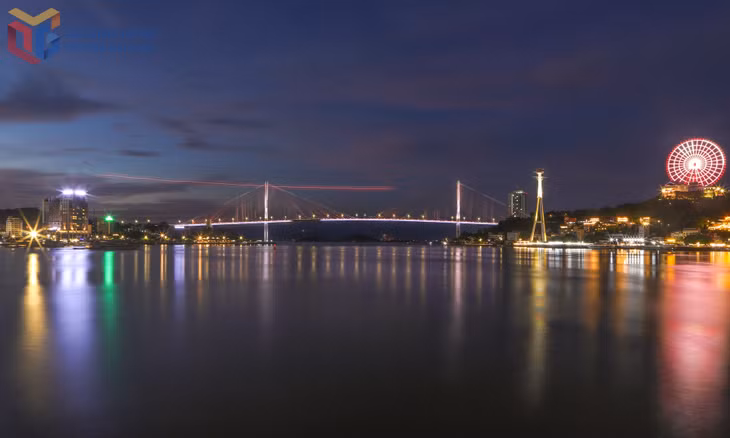 The Cua Luc River glows at night.