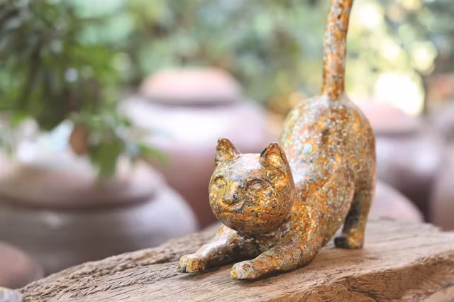 FELINE FINE: Sculptor Nguyễn Tấn Phát's latest collection was inspired by images of the witty and playful cats. VNS Photo Minh Phương