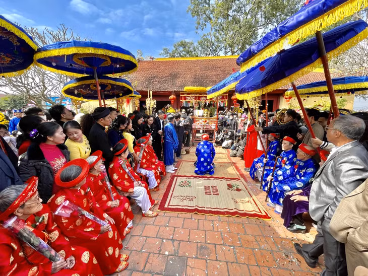 The elders conduct the ceremony inside the temple