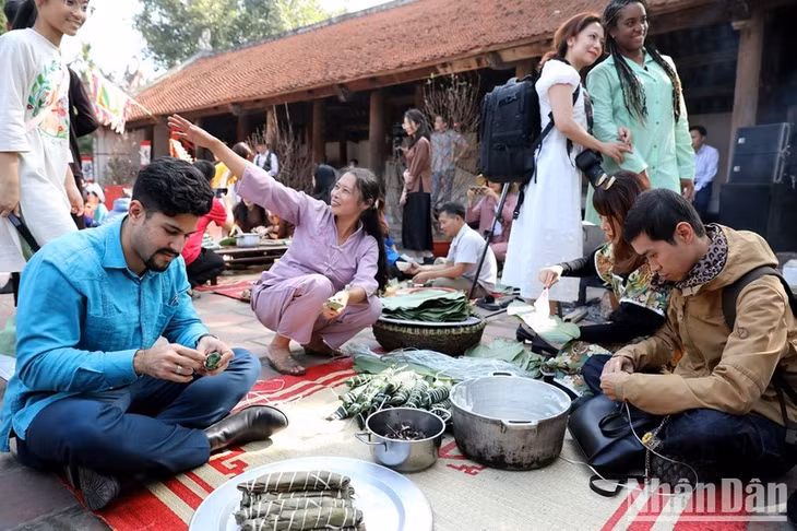 Jose Manuel Labrada Gonzalez from Cuba participates in most of the cultural experiences of the Vietnamese New Year.