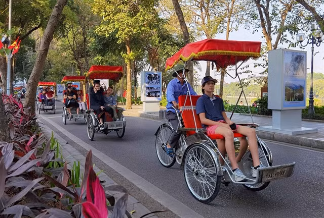 Tourists ride the unique cyclos in Hà Nội. - VNA/VNS Photo Thanh Tùng