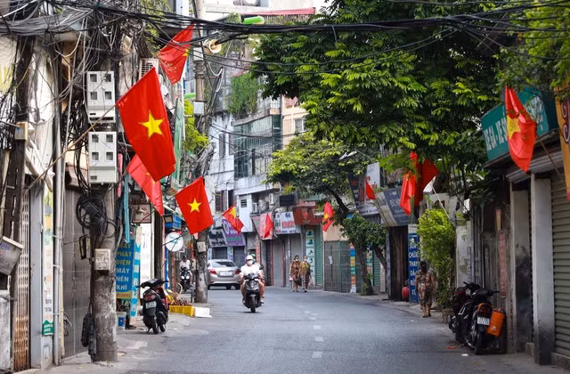 A street in Hà Noi capital is decorated with national flags