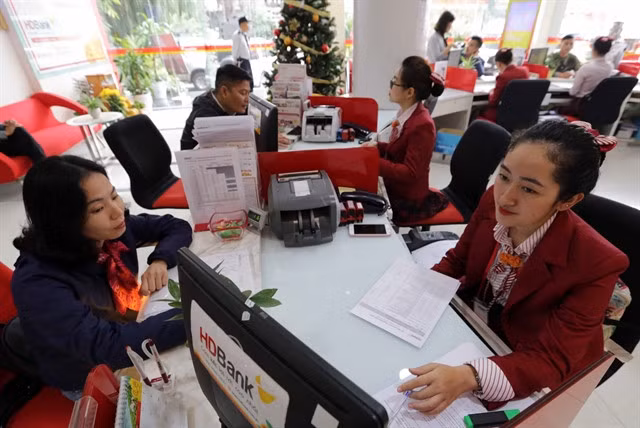 At an HDBank transaction office in Hà Nội City, HDB's shares led the market on Thursday. — VNA/VNS Photo
