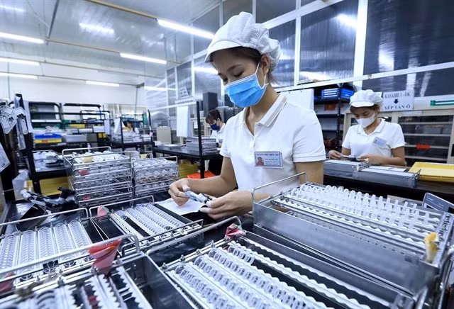 A Japan invested firm in Việt Nam. To meet the 2025 growth target, the Government has called for the simplification of administrative procedures and business regulations. — VNA/VNS Photo