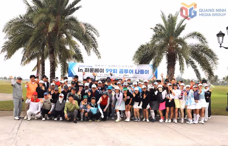 South Korean golf tourists take photos before heading to the course.