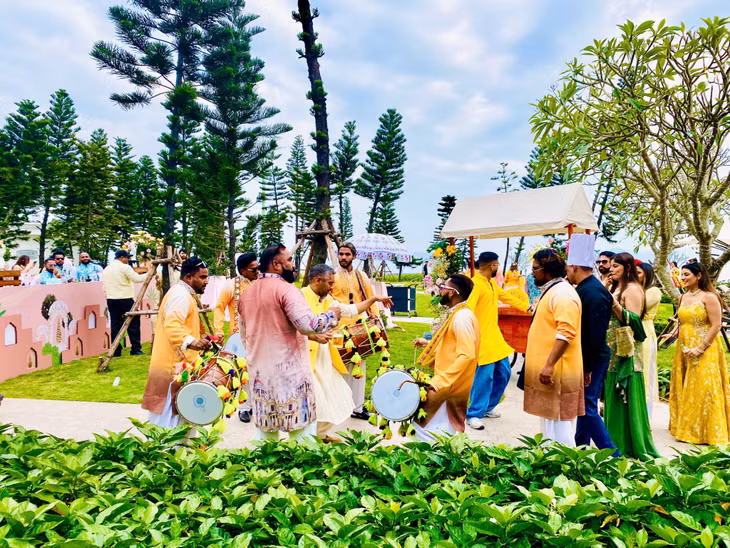 Guests enthusiastically dance to traditional Indian music.