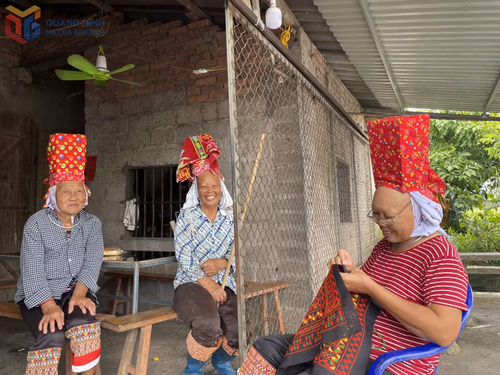 Ethnic minority residents of Dam Ha commune embroider traditional garments.