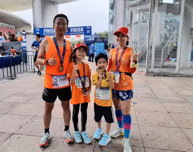 Nguyễn Hữu Dũng’s family often take part in marathons to combine travel with sports. — VNS Photo Thanh Nga