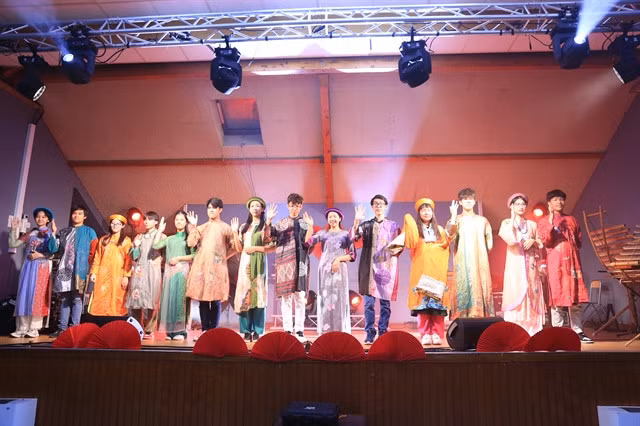 Designer Ella Phan's áo dài collection on stage.