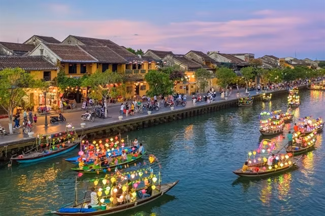 Colourful river boat rides in Hội An, named best-value destination 2024 in the Post Office UK's Holiday Cost Barometer. Photo nguoiquansat.vn