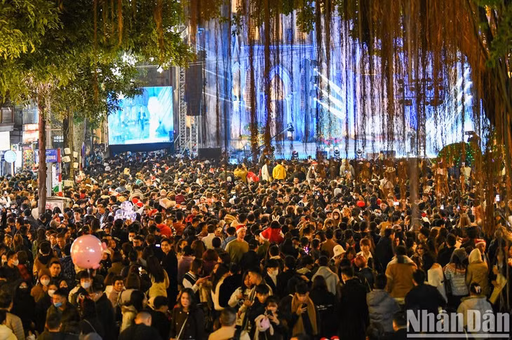 Hanoi locals gather at Saint Joseph Cathedral on Christmas Eve.