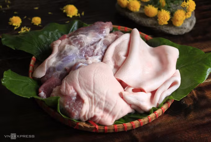 Following a thorough cleaning, deboned pork legs showcase pink skin and bright red meat. Photo by VnExpress/Bui Thuy