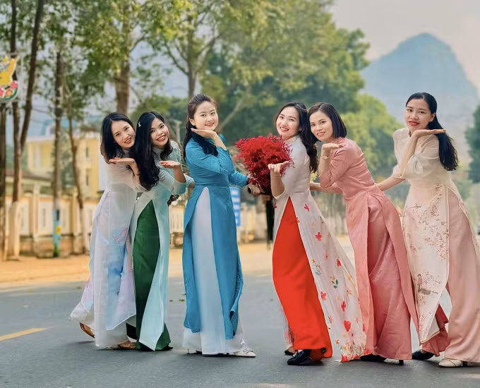 Female employees at a company in Vietnam’s northern province of Thanh Hoa pose for "Ao dai Week" in celebration of March 8. Photo by VnExpress/Le Thu